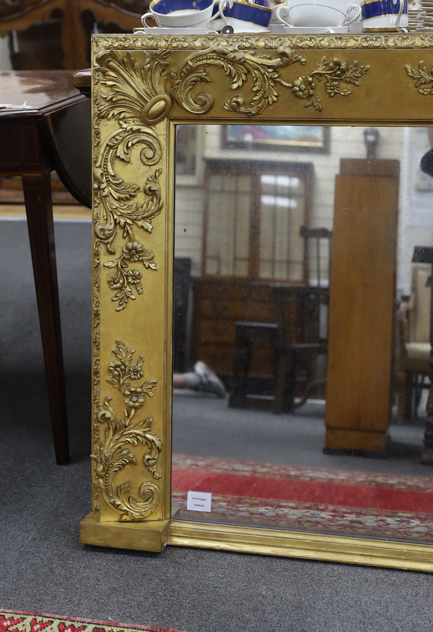 A Victorian giltwood and composition overmantel mirror width 139cm, height 83cm.